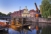 Sailing ships, crane and houses by the old harbour in the Hanseatic town Lüneburg, Lower Saxony, Northern Germany, Germany, Europe