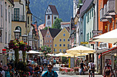 Reichenstrasse with the tower of Hohes Schloss, historic old town of Fuessen and river Lech, Oberallgaeu, Allgaeu, Swabia, Bavaria, Germany