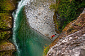 Distant View Of A Packrafter Along The Chehalis River, British Columbia, Canada