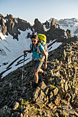 A Woman Hiking On Blaine Peak Below Mount Sneffels In Colorado