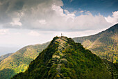Distant View Of A Man Standing On A Mountain Top In The  Smoky Mountain National Park