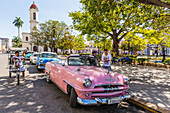Classic 1950's Plymouth taxi, locally known as almendrones in the town of Cienfuegos, Cuba, West Indies, Caribbean, Central America