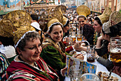 Women wearing the traditional golden hats, Oktoberfest, Munich, Bavaria, Germany