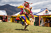Colorful Traditional Masked Tibetian Cham Dancers Performing in Bhutan at the Nomad Festival