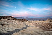 Dawn breaking over the badlands of Death Valley, as viewed from Zabriskie Point, Death Valley National Park