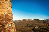 'Climbers on the 2nd pitch of a route called ''The Sublime and the Beautiful''. Located in the heart of the Blue Mountains national park near Sydney in Australia this route provides the perfect mix of a beautiful scenery and amazing climbing on quality sa