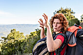 Women, climber, talking about conglomerate climbing at Montserrat Spain