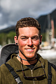 Portrait Of Smiling Member Of Team During The Race To Alaska