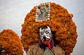 'Tlacololeros de Carrizalillo, Guerrero, wearing sombreros covered by flowers dance during the annual pilgrimage to the Basilica of Our Lady of Guadalupe, Tepeyac Hill, Mexico City, Mexico. Guadalupe is known for indigenous as Tonantzin, that means Our Mo