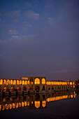 Esfahan, Iran - February, 2008: Khaju Bridge in Esfahan, Iran spans the Zayandeh River and is a popular hangout for locals in the evening.