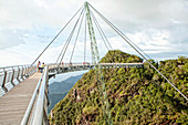 Langkawi cable car is the steepest cable car ride on earth and takes visitors up 708m above sea level to the curved pedestrian sky bridge is built atop Langkawi's second highest peak of Mt. Machinchang.  Langkawi, officially known as Langkawi the Jewel of