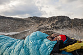 Climber Relaxing Below Mount Marriott In British Columbia, Canada