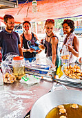 Group Of Happy Friends At Street Food Stall