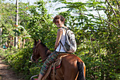 Girl Riding A Horse In Vinales Region In Cuba