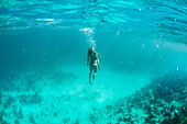 View Of Girl Swimming Underwater In The Coast Of Trinidad, Cuba
