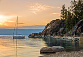 Sail Boat Over The Lake Tahoe During Sunrise