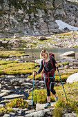 Female Hiker Hiking In The Colorado Wilderness With A Trekking Poles