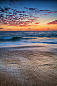 A Long Exposure Of Waves At Sunset On Mexico's Pacific Coast Near Todos Santos, Baja Sur