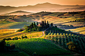 Val d'Orcia, Tuscany, Italy,  Amazing sunrise over the green and golden hills of the Tuscan landscape