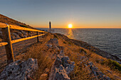 Italy, Apulia, Salento, Capo d'Otranto, Sunrise over lighthouse Palascio