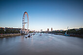 View of River Thames with London Eye the Big Ben and Westminster Palace in  background at dusk London United Kingdom