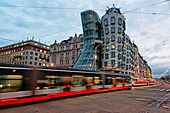 The famous Tancici dum, in the modern district of Prague, photographed with moving bus, Tancici dum, Prague, Czech Republic