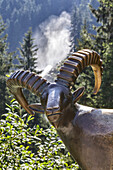 Europe, Austria, Salzburg Land, Krimml, Hohe Tauern National Park, the Krimml Waterfalls, ibex statue in front of the largest waterfall