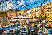 Fishing net frames harbour and village of Camogli Gulf of Paradise Portofino National Park Genoa province Liguria Italy Europe