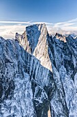 Aerial shot of the north face of Piz Badile located between Masino and Bregaglia Valley border Italy Switzerland Europe