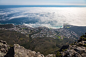 The view from Table Mountain over Camps Bay covered in low cloud, Cape Town, South Africa, Africa