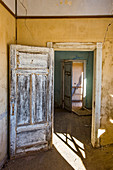 Interior of a colonial house, old diamond ghost town, Kolmanskop (Coleman's Hill), near Luderitz, Namibia, Africa
