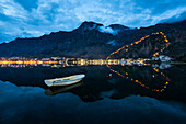 The Old Town (stari grad) and fortress of Kotor reflected in Kotor Bay, UNESCO World Heritage Site, Montenegro, Europe