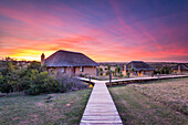 Hlosi Game Lodge during a spectacular sunset over the Amakhala Game Reserve on the Eastern Cape, South Africa, Africa