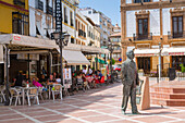 View of statue and restaurants, Plaza del Socorro, Ronda, Andalusia, Spain, Europe