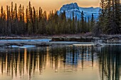 Mountain reflected in lake, sunset