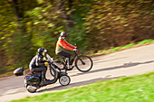 sPedelec, ebike vs Scooter uphill, Muensing, Upper Bavaria, Germany
