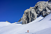 Woman backcountry skiing ascending towards Reichenspitze, Reichenspitze, Zillertal Alps, Tyrol, Austria
