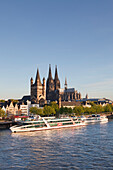 View over the Rhine river to the Old town with Gross-St Martin and Cologne cathedral, Cologne, North Rhine-Westphalia, Germany