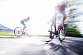 Two young people on their racing cycles in the Kitzbühler Alps, Kitzbühlerhorn, Tyrol, Austria