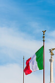 Obelisk and national flag in front of the monument Monumento a Vittorio Emanuele II, Rome, Latium, Italy