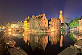 The medieval City Centre, UNESCO World Heritage Site, framed by Rozenhoedkaai canal at night, Bruges, West Flanders, Belgium, Europe