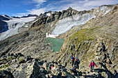 Two persons ascending Aperer Turm, glacier Alpeiner Ferner, Turmferner and glacier lake in background, from Aperer Turm, Stubai Alps, Tyrol, Austria