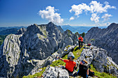 Several persons at summit of Sonneck looking at Kaiser range, Sonneck, Kaiser range, Tyrol, Austria