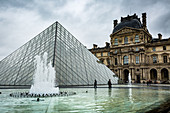 The large pyramid sits in the main courtyard and is the main entrance to the Louvre Museum, Paris, France, Europe