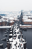 Charles Bridge over the Vltava River in winter, UNESCO World Heritage Site, Prague, Czech Republic, Europe
