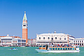 Campanile tower, Palazzo Ducale (Doges Palace), Bacino di San Marco (St. Marks Basin) and water taxis, Venice, UNESCO World Heritage Site, Veneto, Italy, Europe