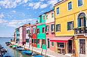 Brightly coloured fishermens cottages on the island of Burano in the Venice lagoon (Venetian lagoon), Venice, UNESCO World Heritage Site, Veneto, Italy, Europe