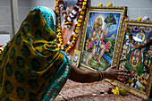 Faithful touching pictures of deities, Shree Ram Mandir, Leicester, Leicestershire, England, United Kingdom, Europe