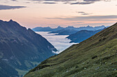 Along the Grossglockner alpine road, panorama to the valley covered by the clouds, in the distance the Berchtesgaden Alps, Fusch an der Grossglocknerstrasse, Austria