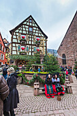 A typical house of the medieval old town enriched by Christmas ornaments Kaysersberg Haut-Rhin department Alsace France Europe